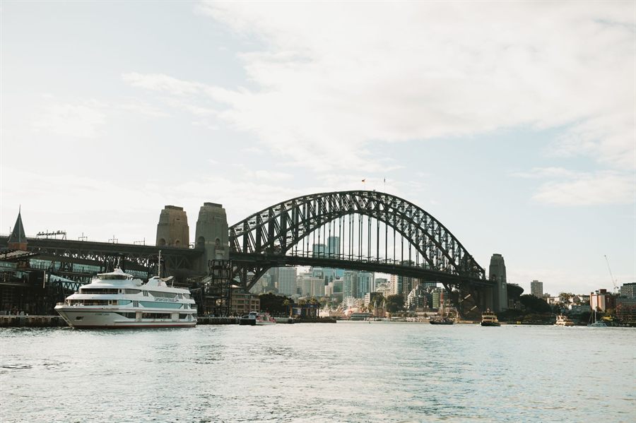 Small ship on Sydney Harbour in front of the Harbour Bridge